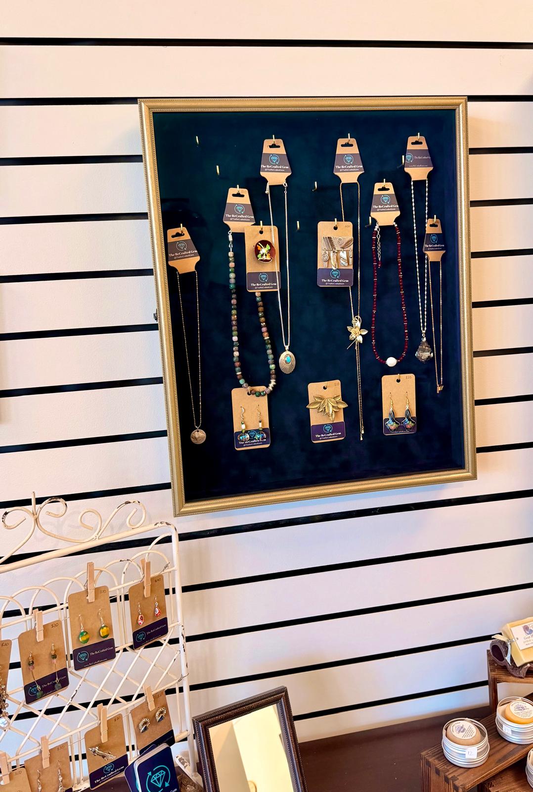 ReCrafted Gem necklace display case at Willard Art and Framing